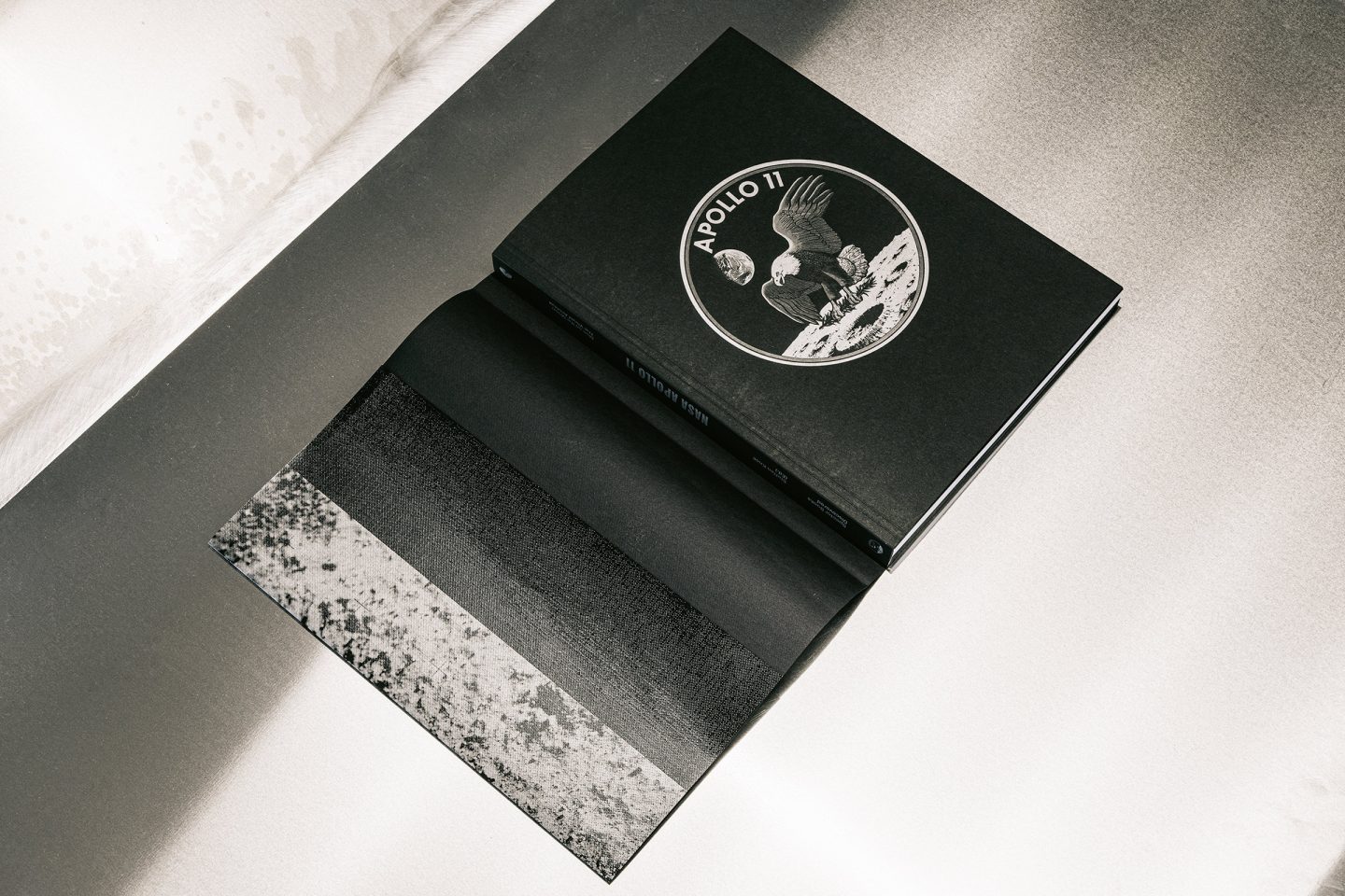 Black slipcase and printed cover of NASA archive publication