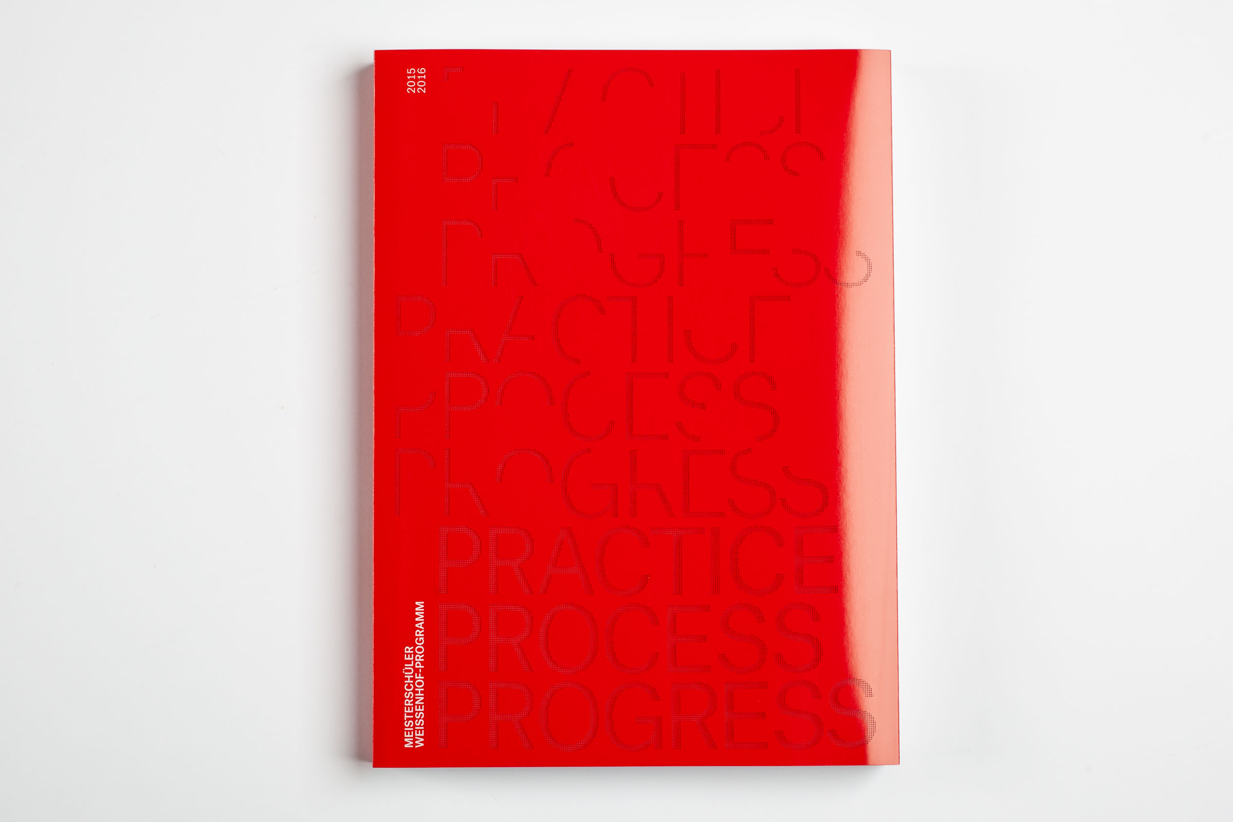 The dust jacket of »Practice. Process. Progress«, a red, laser-cut fedrigoni cardboard