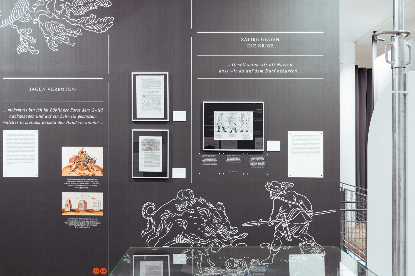 Museum exhibition wall with satire, hunting and illustrated figures in white line drawings.