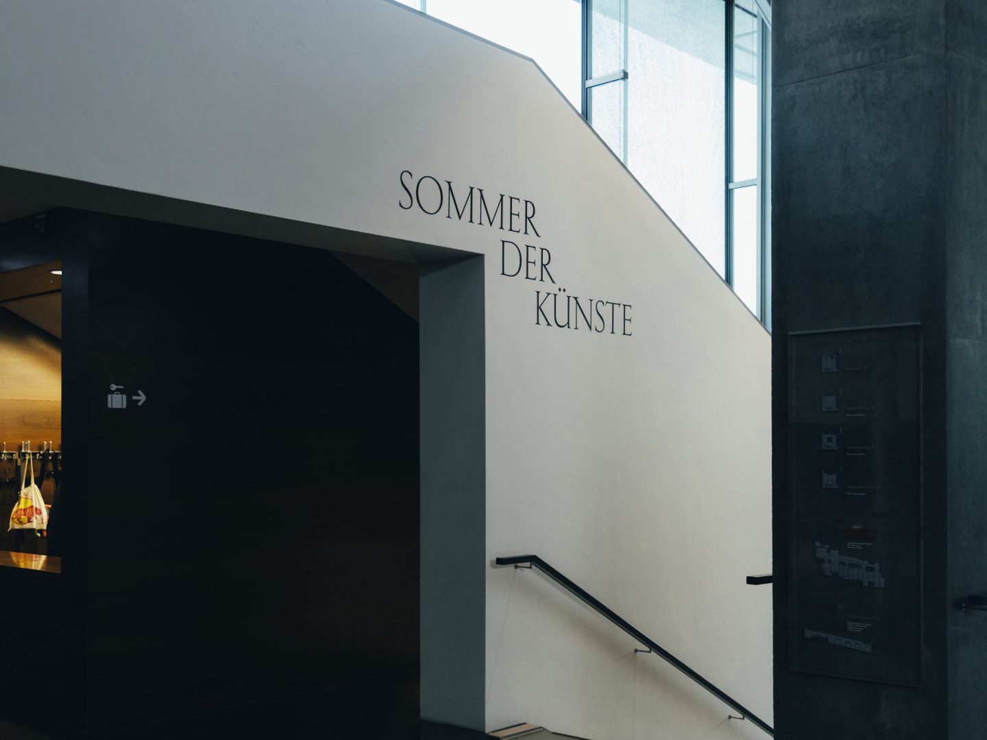 Sommer der Künste vinyl wall text applied to an interior stair wall.