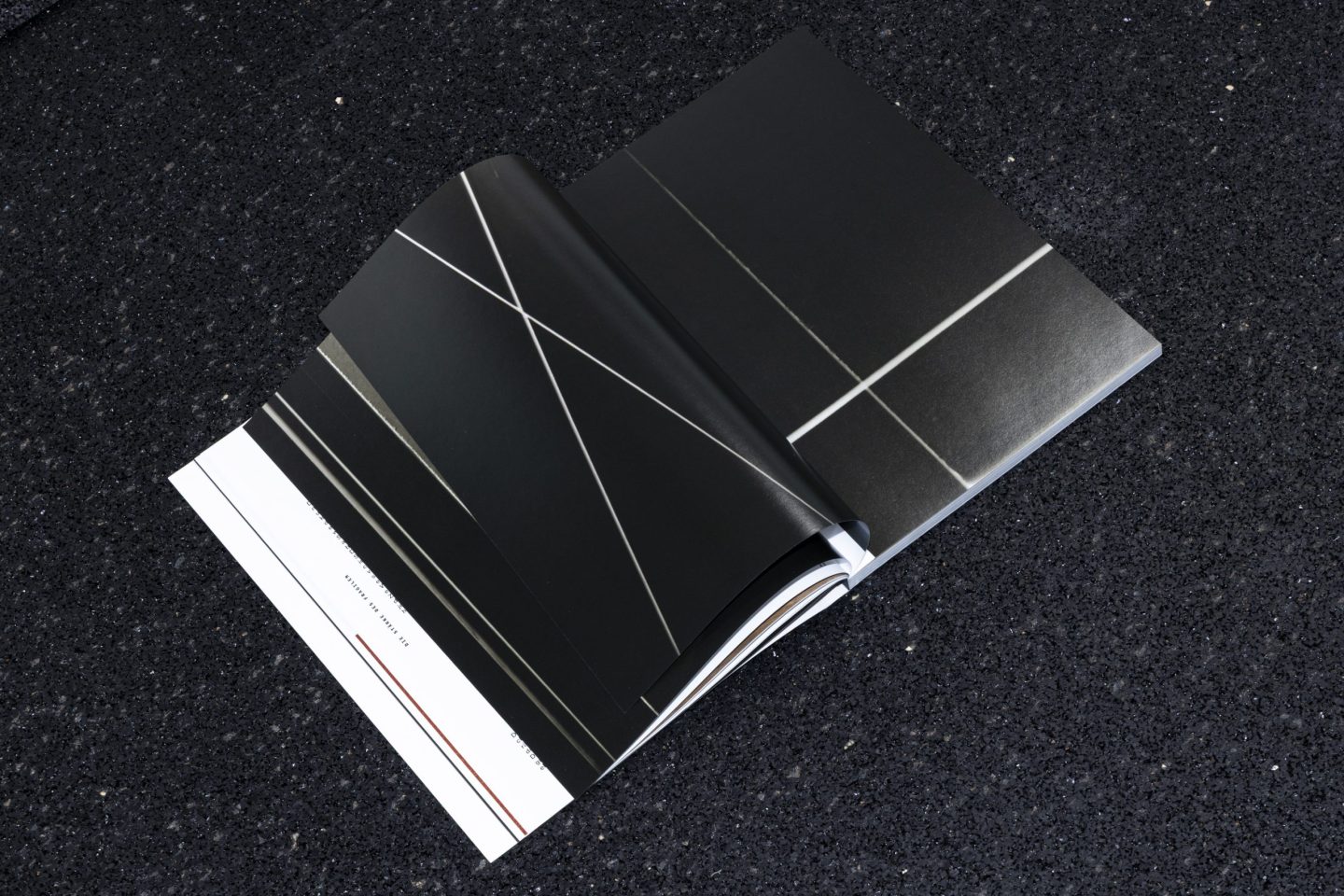 Catalogue design for the ABK Stuttgart Meisterschüler exhibition at Villa Merkel Esslingen, featuring a full-bleed photographic spread with a reduced editorial layout and black-and-white image composition.