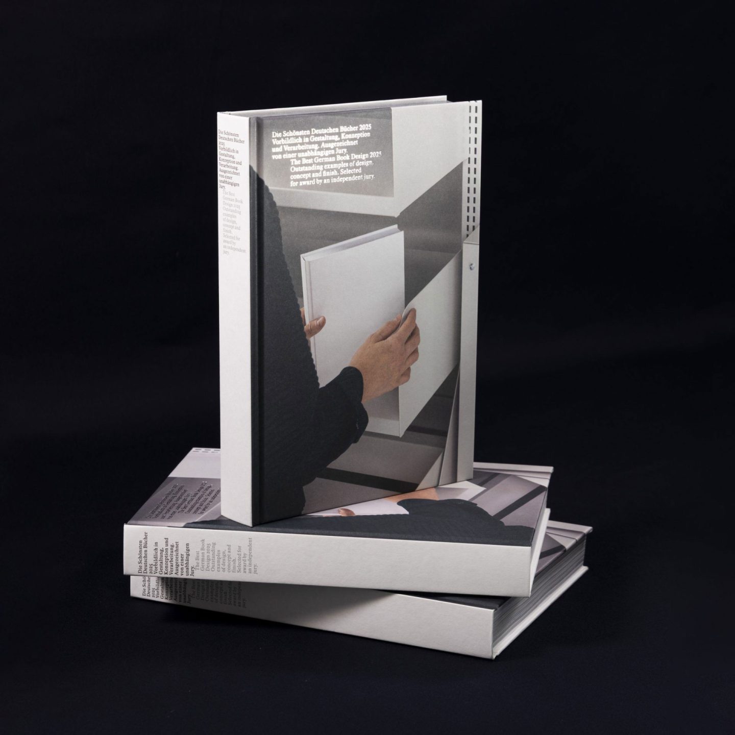 Book design for Die Schönsten Deutschen Bücher 2025, featuring a photographic cover motif, bilingual typography and a refined hardcover binding.