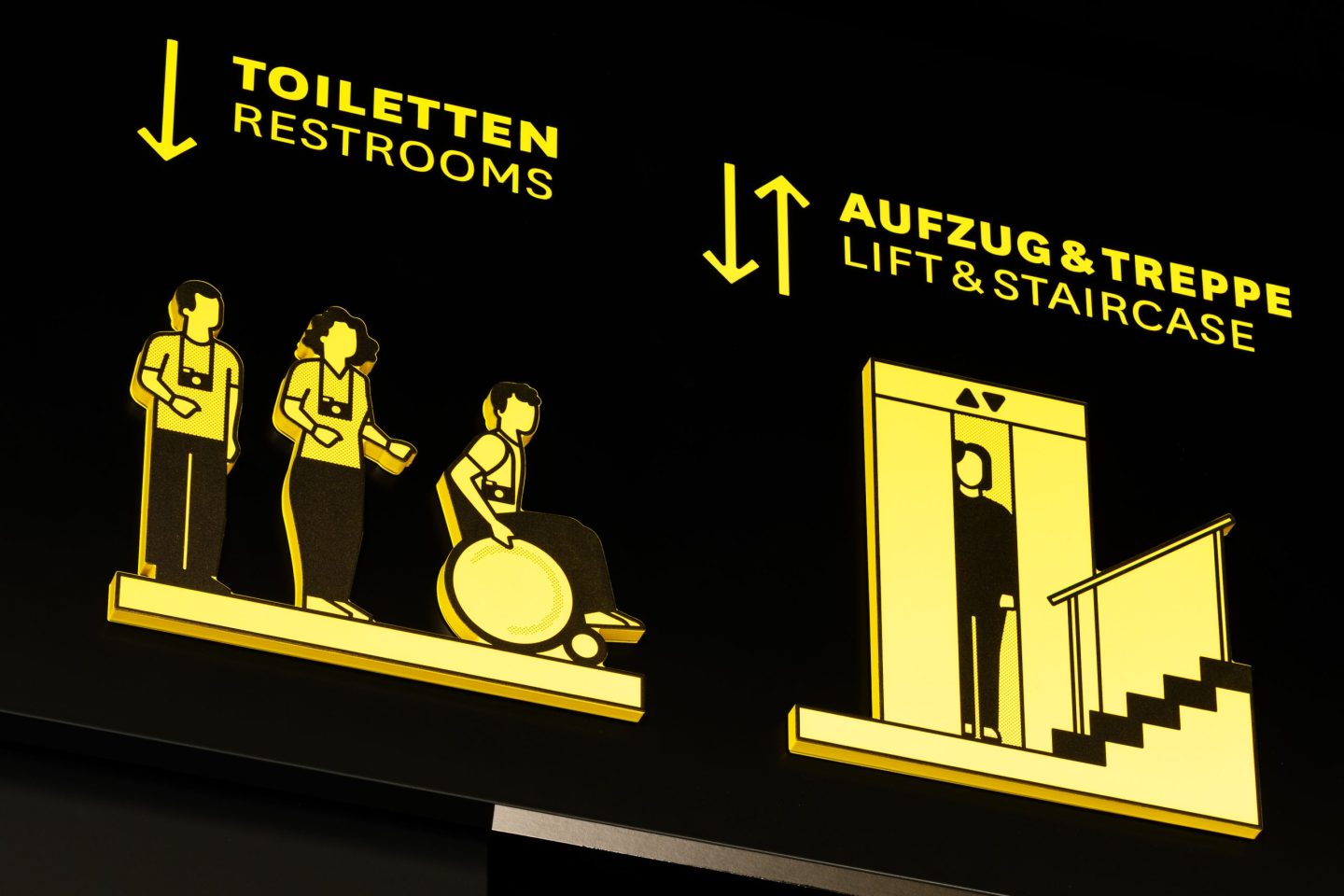 Signage for Haus des Tourismus, featuring clear typographic wayfinding and a reduced graphic layout.