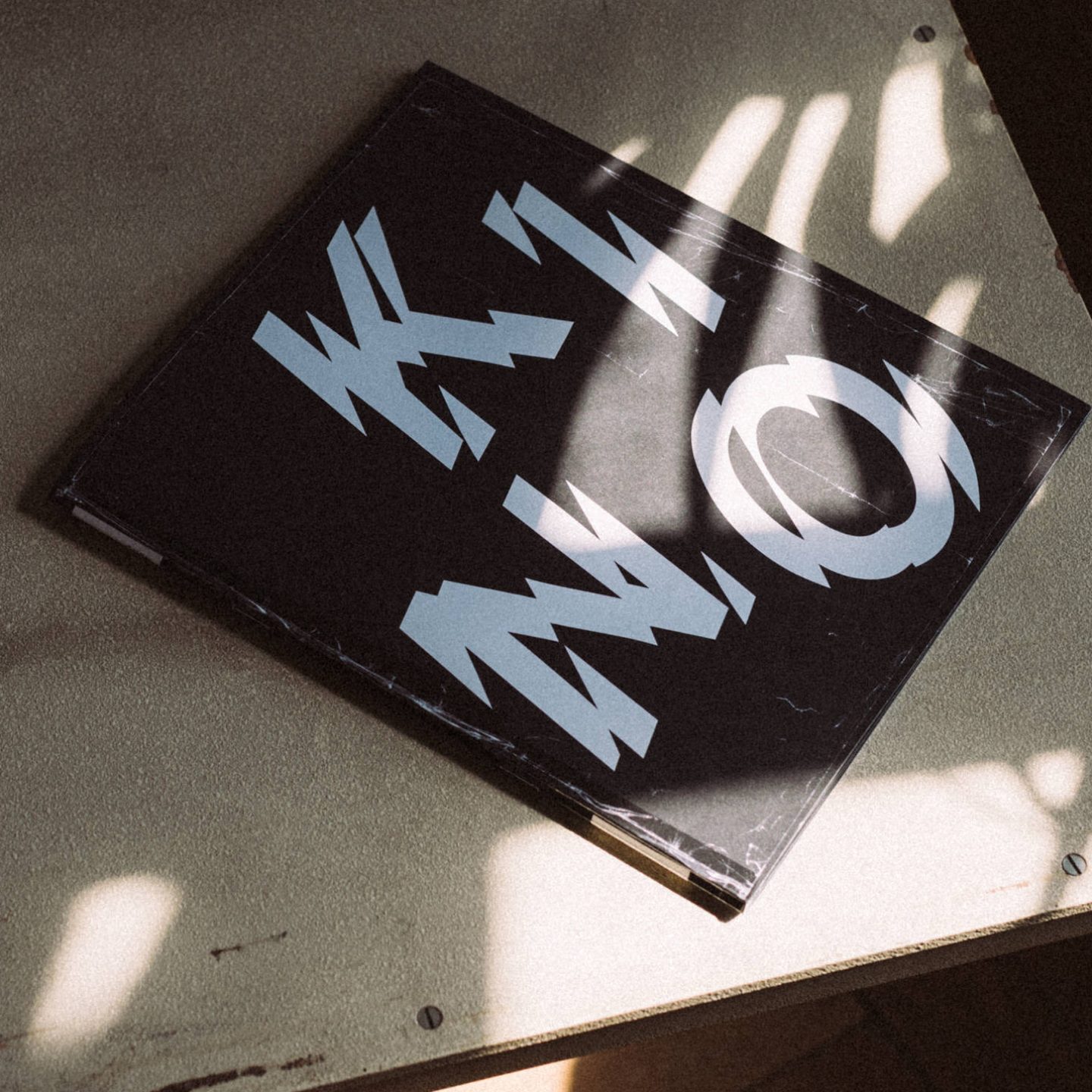 Kino publication design by Studio Tillack Knöll for Ricarda Roggan and Bernd Kuchenbeiser, featuring a bold typographic book cover in black and white.