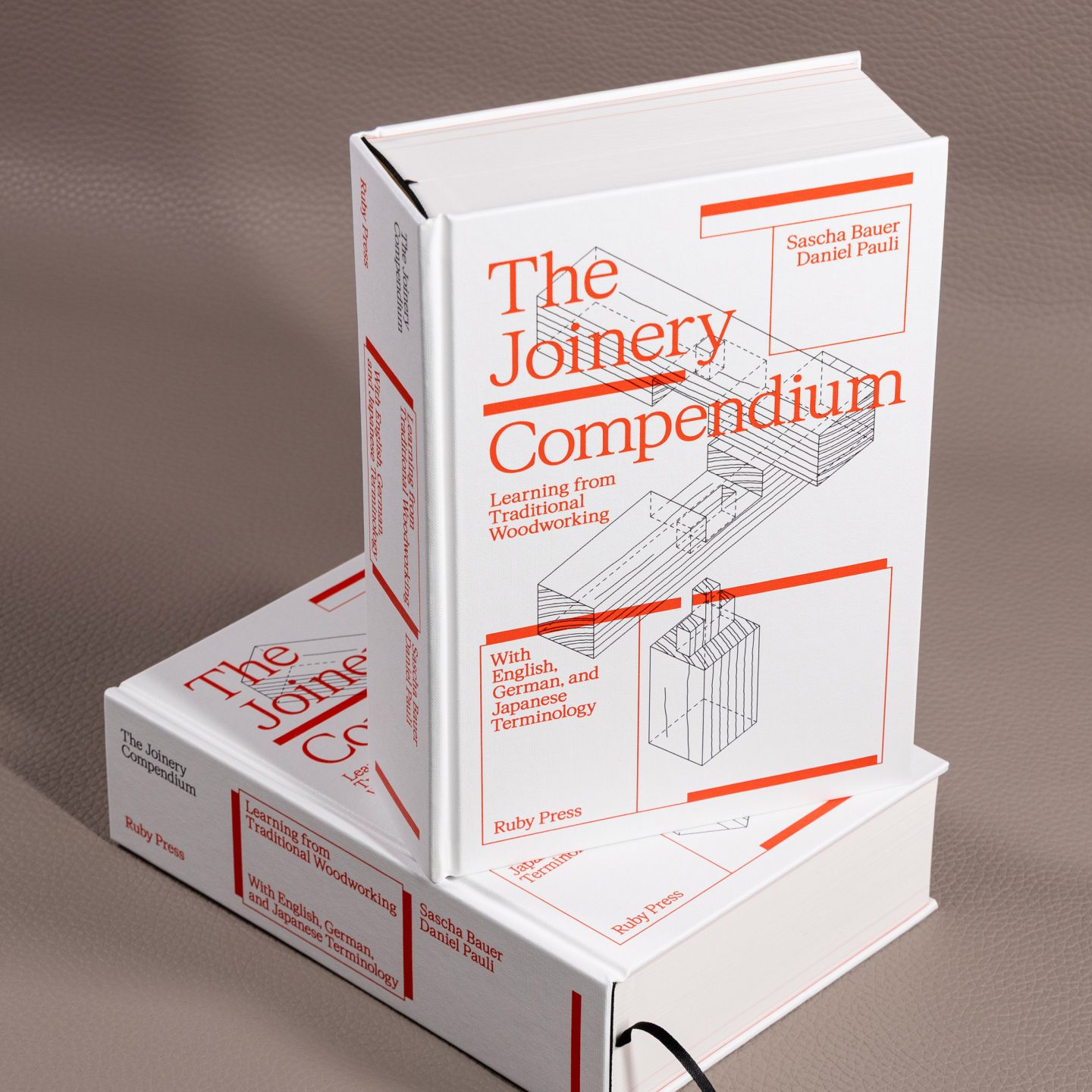Book design for The Joinery Compendium published by Ruby Press, featuring a white hardcover with red typography and technical woodworking diagrams.